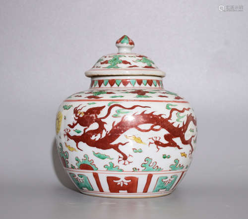 A MUTICOLOURED POT WITH DRAGON PATTERNS