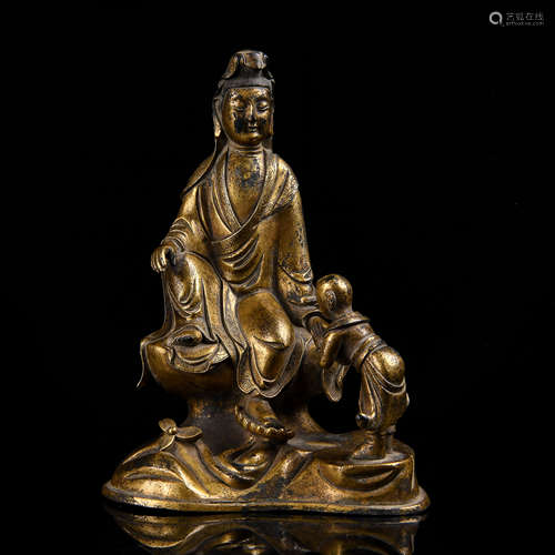 A COPPER-GILDED STATUE OF BOY WORSHIPING  GUANYIN