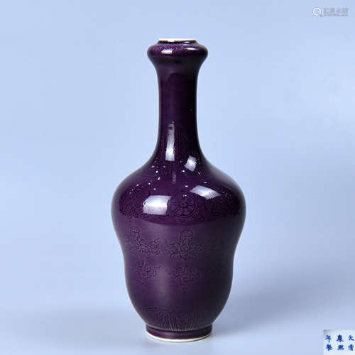 AN AUBERGINE GLAZE FLASK DARKLY CARVED WITH BUDDHA BABAO PATTERNS