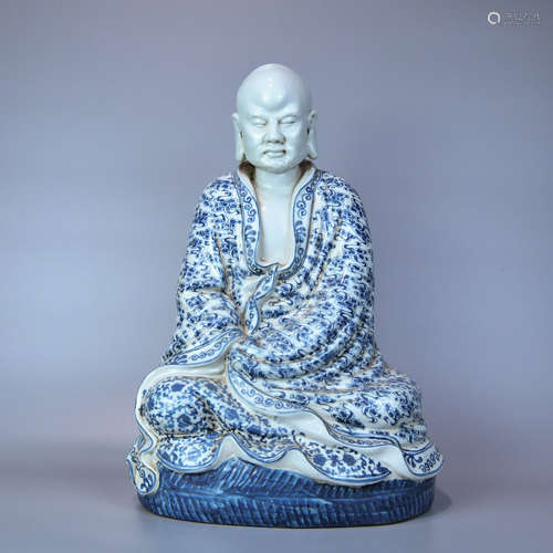 A BLUE AND WHITE STATUE OF ARHAT