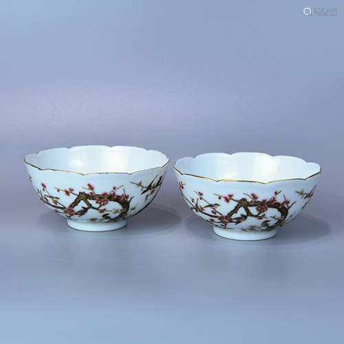 A PAIR OF POWDER ENAMEL TEA CUPS PAINTED WITH MAGPIES ASCENDING PLUM