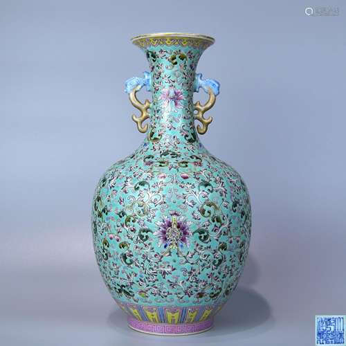 A SPEARMINT GLAZE AND FOREIGH COLORED BOTTLE WITH DOUBLE EARS AND PAINTED WITH FLOWER PATTERNS