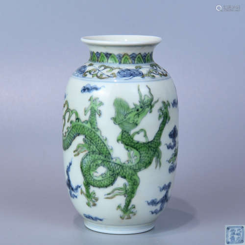 A OVERGLAZED BOWL PAINTED WITH GREEN DRAGONS