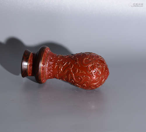 A RED GLAZE GOURD CARVED DRAGON PETTERNS