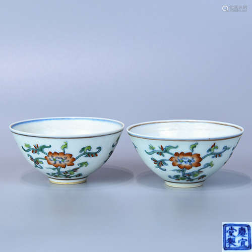 A PAIR OF OVERGLAZED BOWLS WITH FLOWER PATTERNS