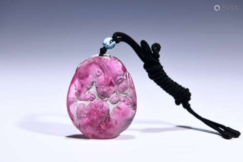 A CHINESE TOURMALINE CARVED PENDANT