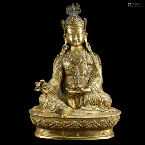 A CHINESE GILT-BRONZE FIGURE OF PADMASAMBHAVA