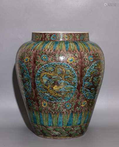 A MUTICOLOURED POT WITH DRAGON PATTERNS