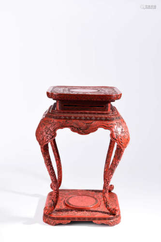 A CHINESE CARVED RED LACQUER SIDE TABLE