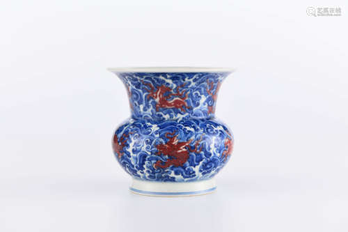 A CHINESE UNDERGLAZED COPPER-RED BLUE AND WHITE PORCELAIN BIN