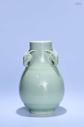 A CHINESE PEA GREEN GLAZED PORCELAIN ZUN