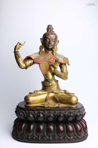 A Chinese Bronze Manjusri Statue