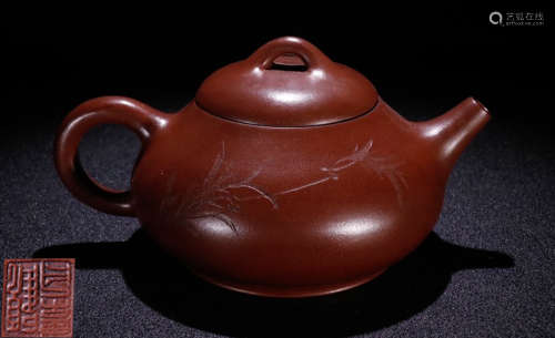 A ZISHA TEA POT CARVED WITH BAMBOO PATTERN