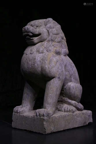 A STONE ORNAMENT SHAPED WITH LION