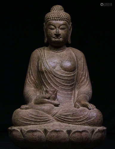 A STONE BUDDHA STATUE