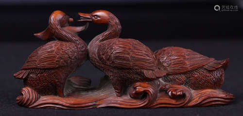 A HUANGYANG WOOD PAPERWEIGHT SHAPED WITH DUCK