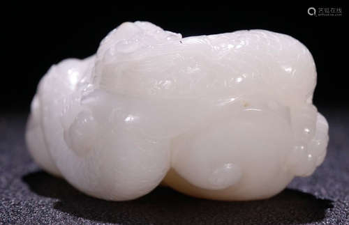 A HETIAN JADE BEAST PENDANT