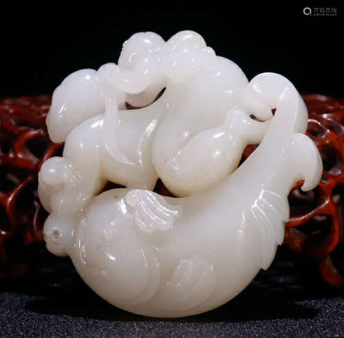 A HETIAN JADE BEAST PENDANT