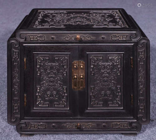 A ZITAN WOOD CABINET CARVED WITH BEAST PATTERN