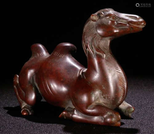 A COPPER ORNAMENT SHAPED WITH CAMEL