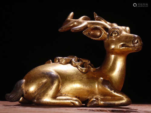 A GILT BRONZE PAPERWEIGHT SHAPED WITH DEER