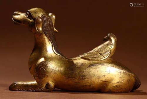 A GILT BRONZE PENDANT SHAPED WITH DOG