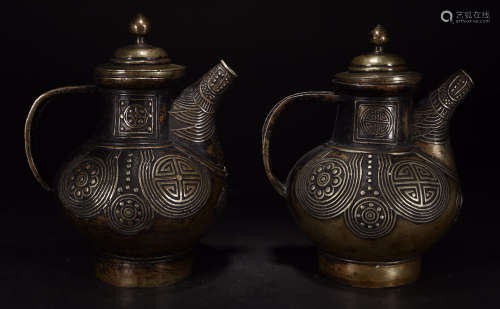 A COPPEPOT WITH SILVER POT CARVED WITH PATTERN