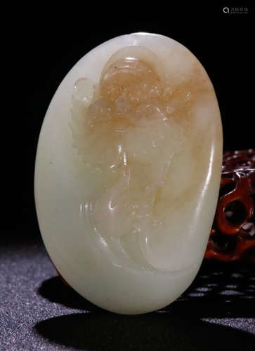 A HETIAN JADE PENDANT CARVED WITH STORY