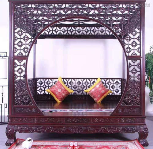 A ZITAN WOOD BED HOLLOW CARVED