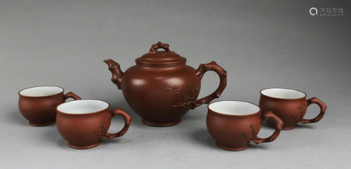 A Yixing Zisha Teapot with Four Cup Set