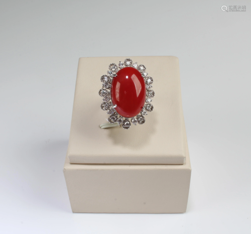 A Platinum Gold Diamond Ring with Red Coral…