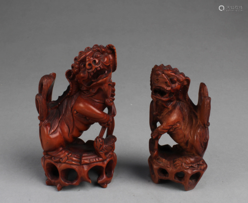 A Group of Two Carved Wooden Foo Lion Display