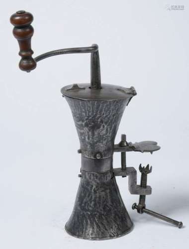 Wrought iron coffee grinder in the shape of an \