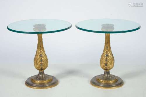 Pair of round pedestal tables in carved wood, silv…