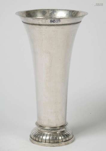 Silver cornet vase resting on a pedestal gadrooned…