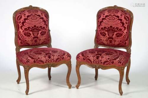 Pair of Louis XV style carved walnut chairs in car…