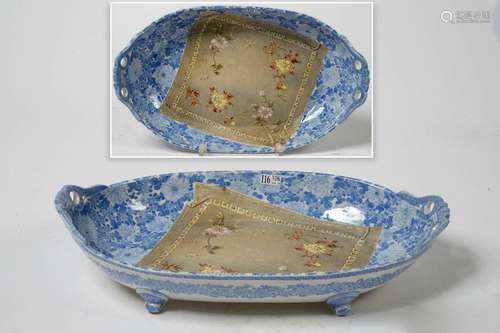 A large oval dish in blue and white Japanese porce…