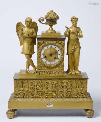 Restoration style clock in gilt bronze surmounted …