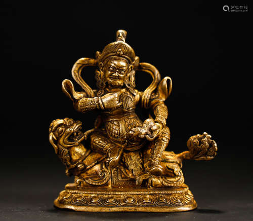 CHINESE GILT BRONZE FIGURE OF JAMBHALA