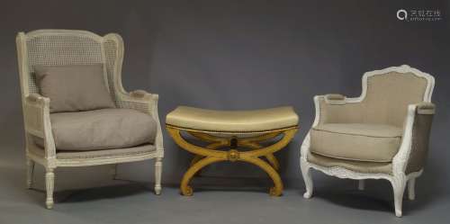 A Louis XV style white painted bergere armchair retailed by Graham and Green, of recent