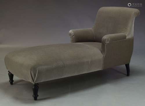 A modern grey velvet chaise longue, of recent manufacture, with curved back above conforming arms,