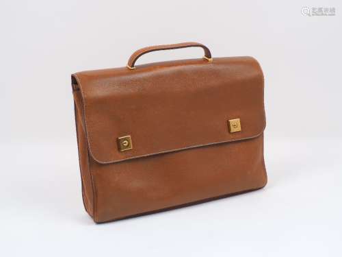 A Hermes tan leather satchel bag, the rectangular form body with square yellow metal fittings, inner
