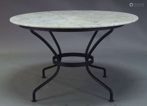 A modern marble top dining table, late 20th Century, with circular Carrera marble top on tubular