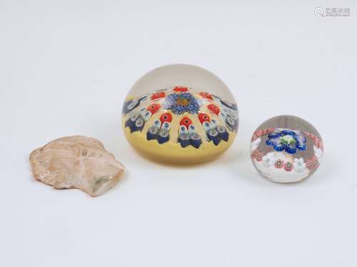 A millefiori glass paperweight, of typical form, decorated in a red, blue and yellow palette, 8cm