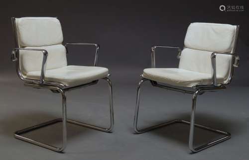 A pair of chromed cantilever armchairs by Luxy, Italia, c.1970-80, with cream leather upholstered