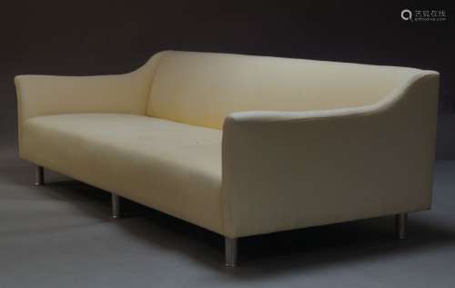 A pair of large modern sofas, of recent manufacture, upholstered in light yellow fabric, each with