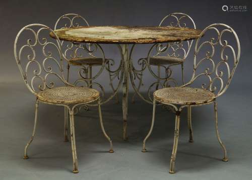 A white painted cast iron garden table, second half 20th Century, the circular top on tri-form