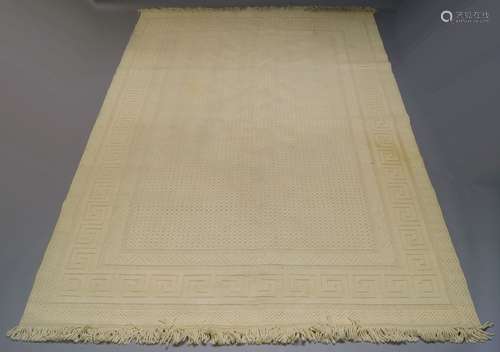 A Scandinavian wool cream ground carpet, with raised field and Greek key border, 336cm x 238cmPlease