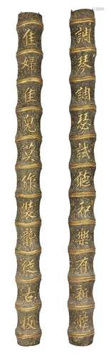 A pair of Chinese wood bamboo-form columns, late Qing dynasty, painted and carved to each section