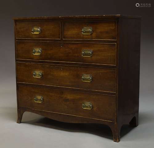 An early Victorian mahogany chest, with two short over three long graduated drawers, raised on